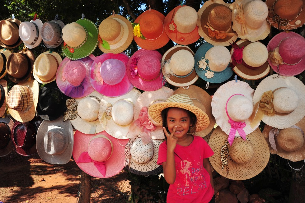 Girl selling hats