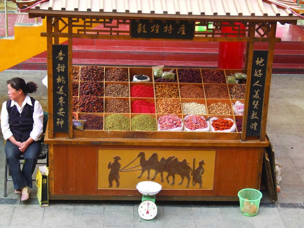 Nuts and dried dates displayed at a food stall, remnants of Persian culture from the Silk Road.