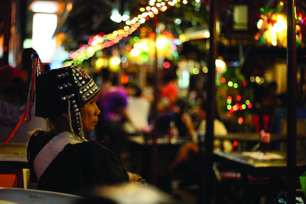 The night markets around Silom Road, as a Northern tribeswoman take a rest.
