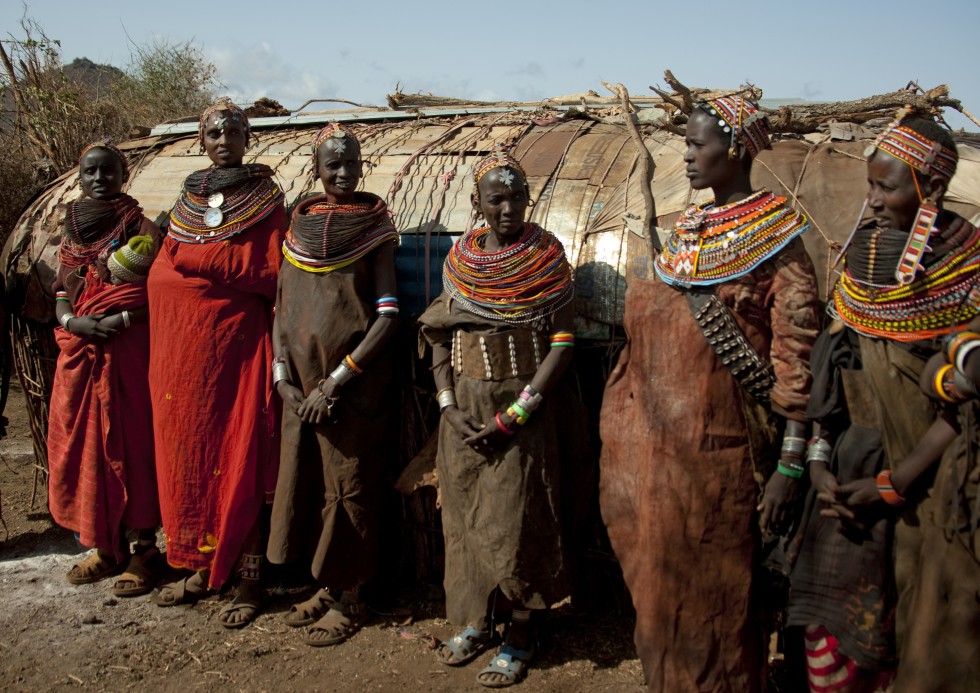 The beads refer to different important periods in the women’s lives, as certain patterns are used for certain events. A necklace can be read as a personal history, or as a diary. Each colour has a meaning: white is purity and health, representing cow’s milk; black is hardship; yellow and orange, the