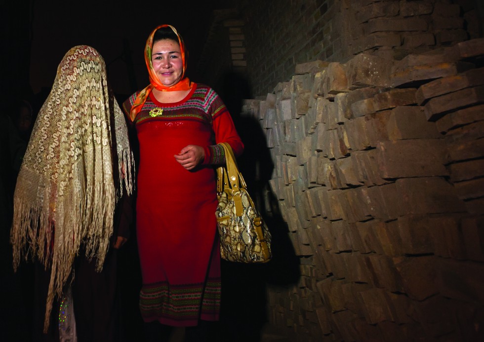 Kashgar: A sign reads “Forbidden to tourists”. I break the law and find myself lost in a labyrinth of back streets in the middle of a Uighur marriage celebration. The men take turns dancing while the women are busy preparing the party at the house of the betrothed.