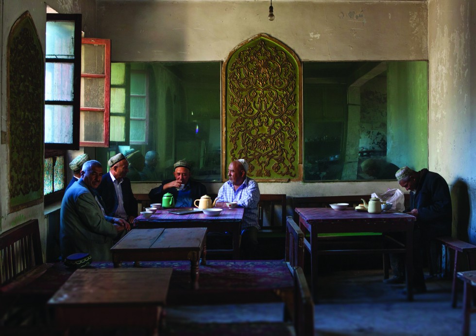 Kashgar: The House of Ostangboyi. On the dark staircase, every stair feels like it’s going to collapse. Customers dunk bread into their hot teas. Saffron tea is the house speciality.