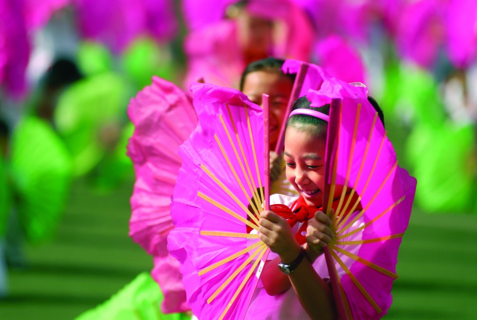 Displayed quietly amidst daily life in hutongs and night markets, or on full display in a performance of Beijing Opera, the enduring culture of China is visible in the portraits of her people.