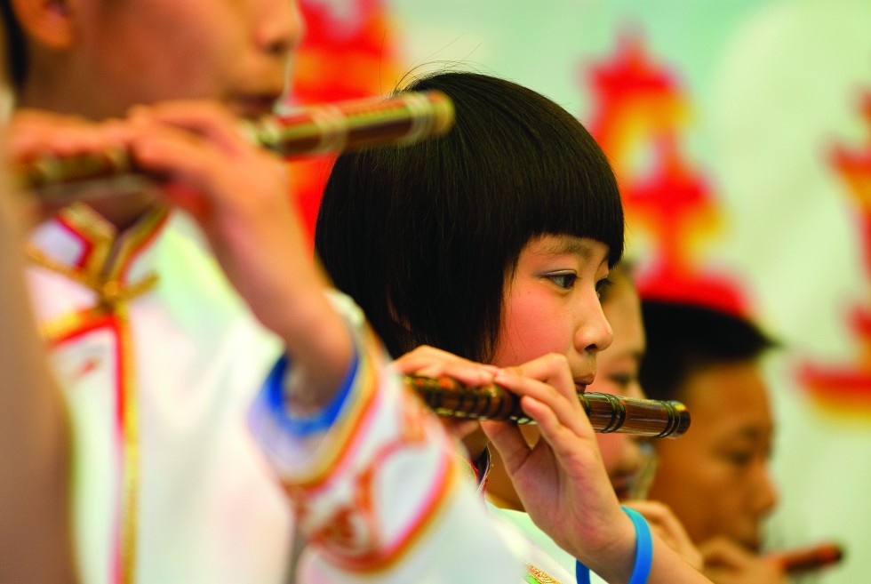 Displayed quietly amidst daily life in hutongs and night markets, or on full display in a performance of Beijing Opera, the enduring culture of China is visible in the portraits of her people.