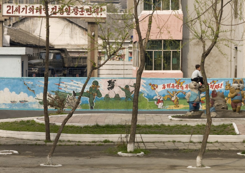 Decorated wall at a school in Pyongyang; the American is symbolized by a wolf killed by the North Korean soldier.