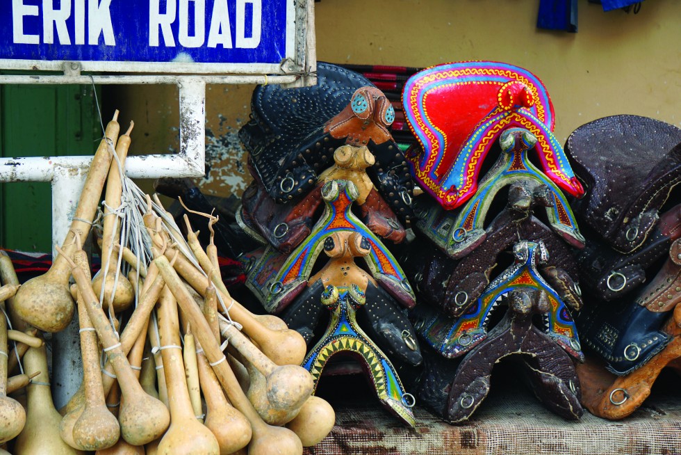 Horses, donkeys and camels remain central to life in Kashgar; here, ornamental saddles are sold on an old town corner.