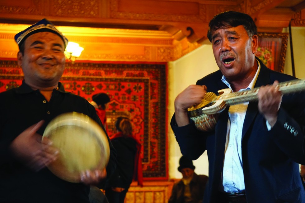 Uyghur musicians perform for guests at the Ostang Boi teahouse, where Uyghur men have traditionally met to discuss politics and business.