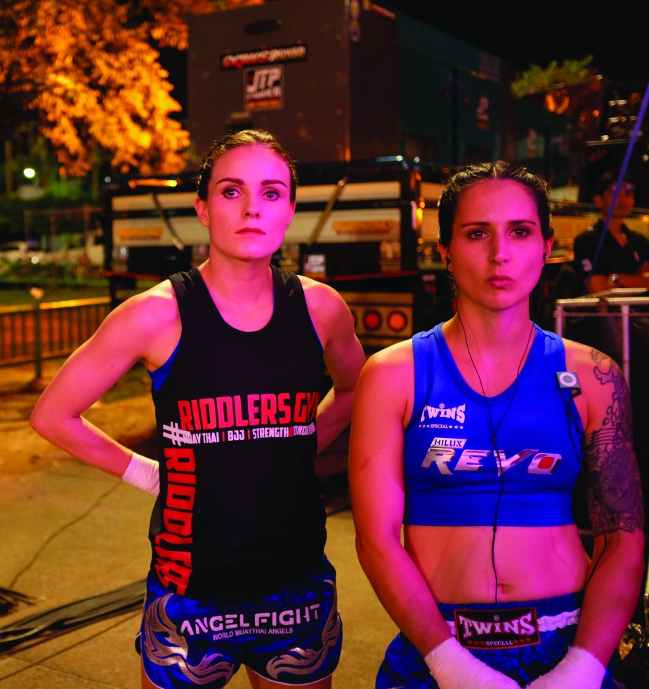 Nicole Collander and Natalie Morgan looking at other contestants at Angel Fight, an all-female tournament.