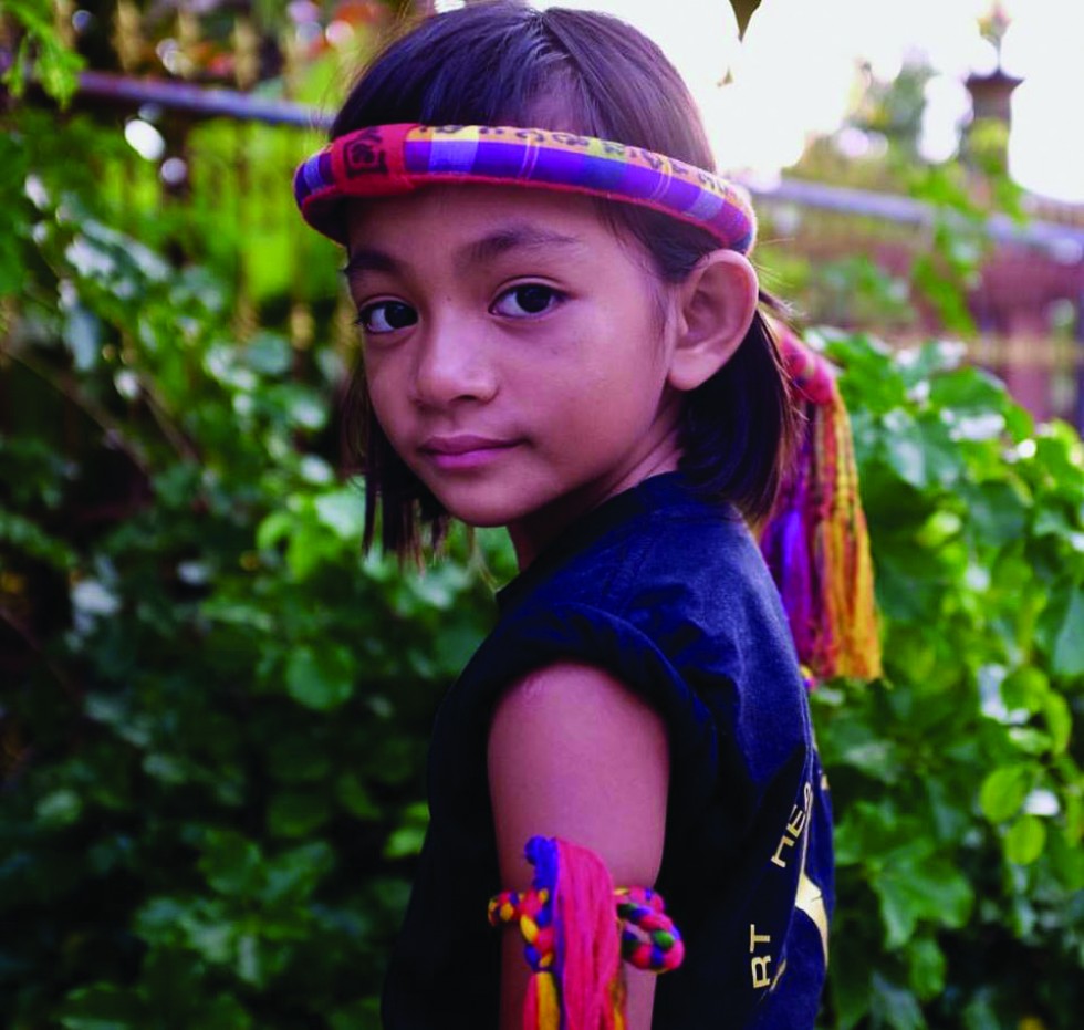 Nungning Wor Watthanaya poses with the traditional mongkon and prajiat. In her first bout she beat a young girl named Cucumber for 300 baht. Nungning is an active fighter in rural northeast Thailand