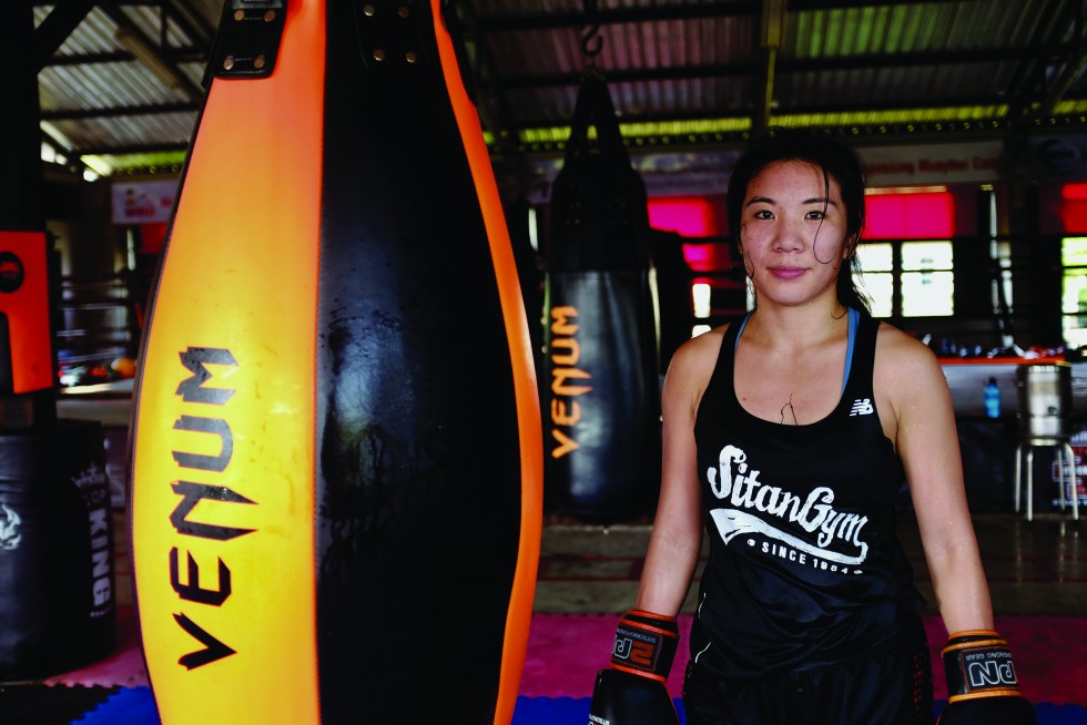 Drew Saludares Lei in between rounds as she trains in Bangkok. The American Angela Chang from Sitan Gym in NYC is now the resident nak muay ying at the famous Sitsongpeenong Gym in Bangkok.