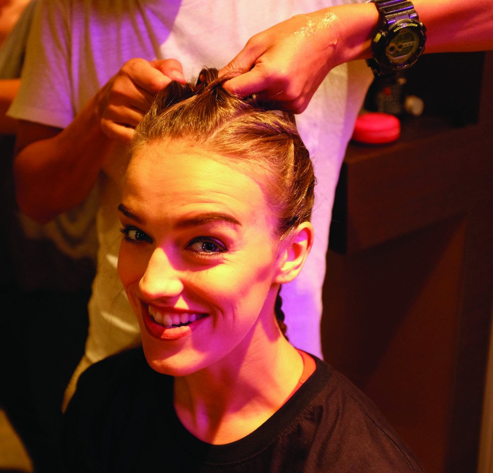 Lucy Payne of the UK getting her hair and make-up done in preparation for a bout.
