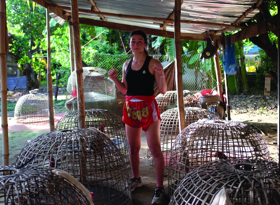 Jasmine Parr in the gym where legendary fighter Pornsanae Sitmonchai trains his fighting chickens. Australian Parr is setting out to make a name for herself and beat Wonder Girl in Southern Thailand on points.