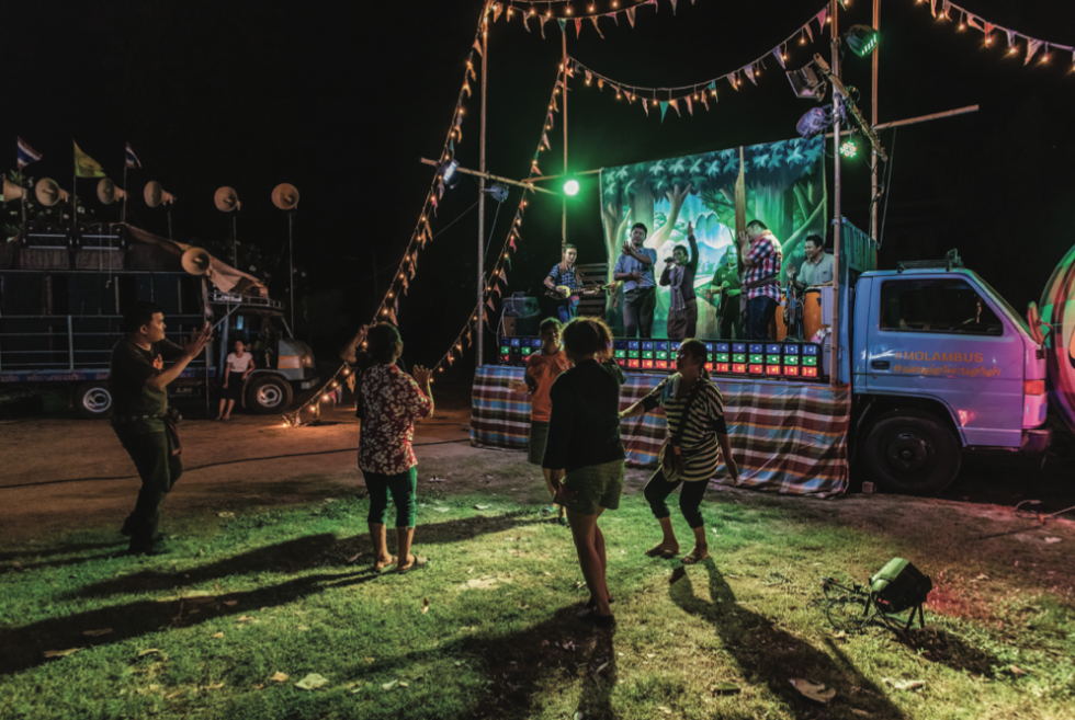 Villagers enjoy the evening show at Wat Ta Pung.