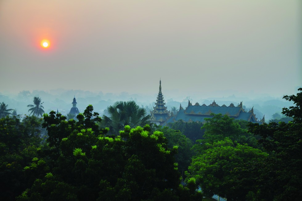 Yangon, Myanmar:Succeeding ridges— rising quilt of mist-laced dawn— suburban rooftops