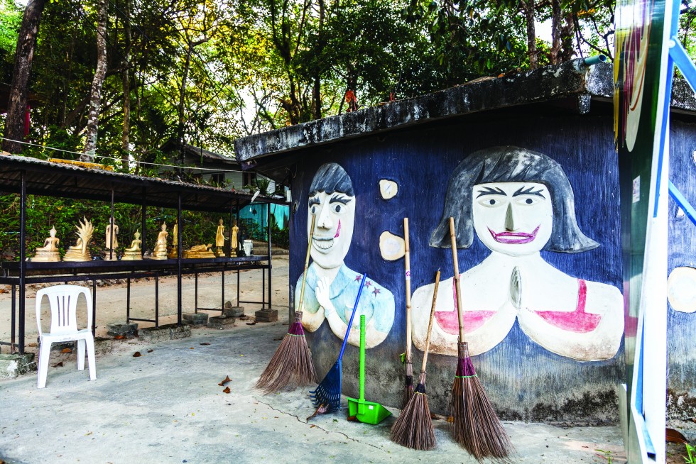 Wat Ko Phayam is worthy of quiet exploration, with jungle and seaside statues, temples and monastic housing.