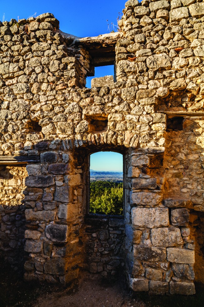 View of the Cévennes foothills seen through castle ruins at Alègre.