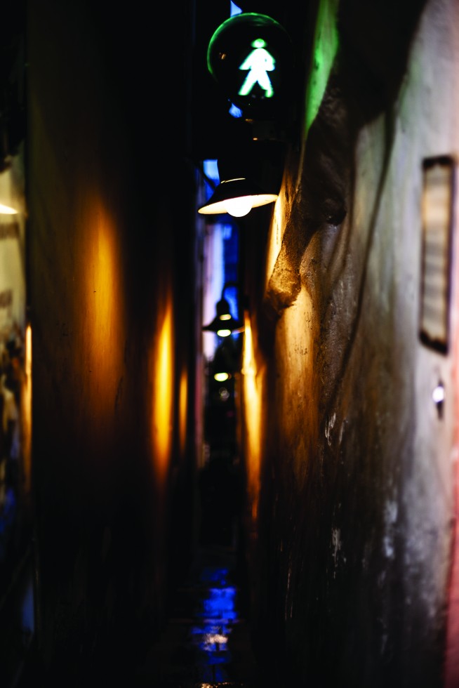 A pedestrian lane so narrow it has a signal controlling who may walk.