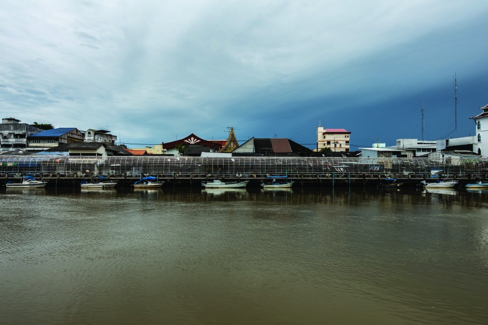 A riverside promenade from within and across the water.