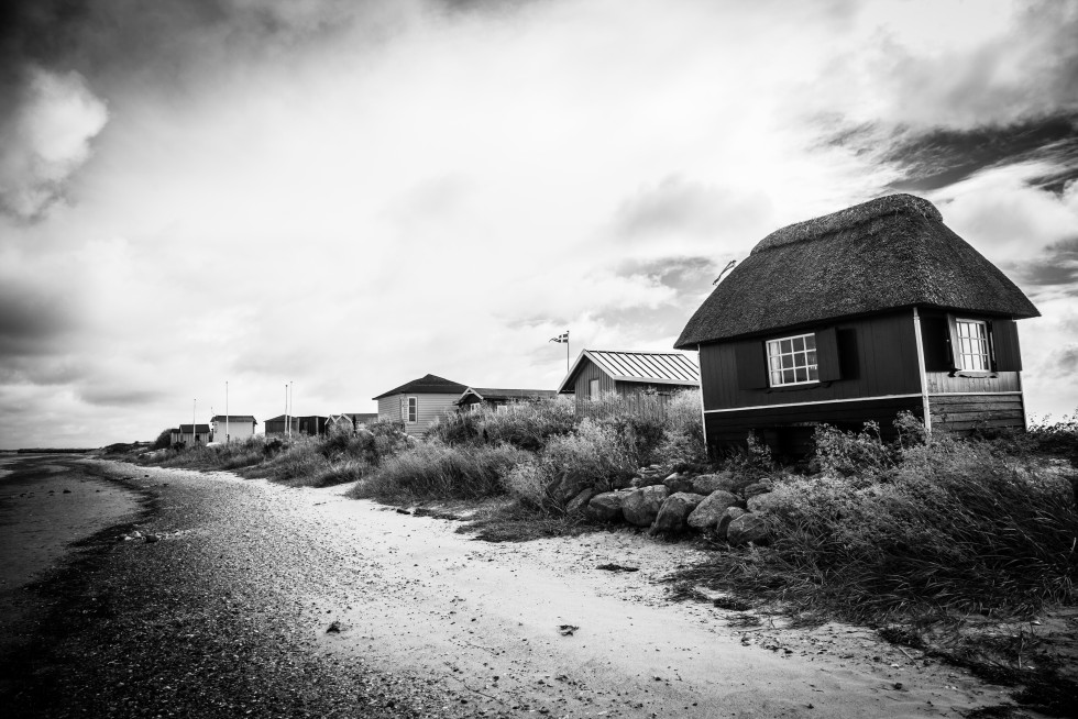 It is popular to own a beach hut for summer use; these sit on a narrow isthmus with ocean and beach along both sides.