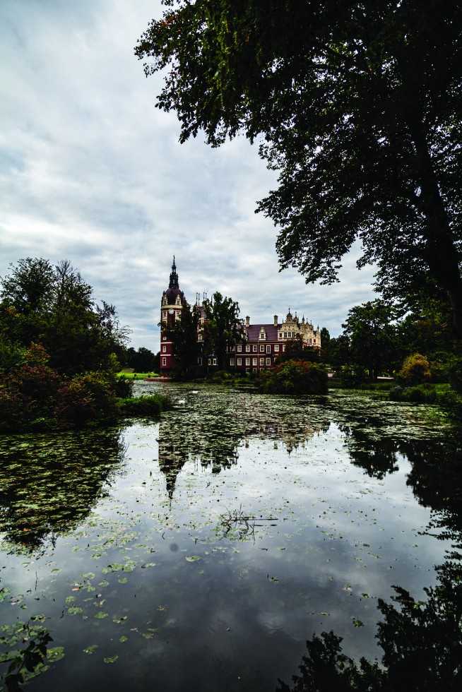 Hunting lodge and castle reflected in Muskau Park.